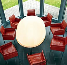 Modern meeting room with 8 chairs around a large table